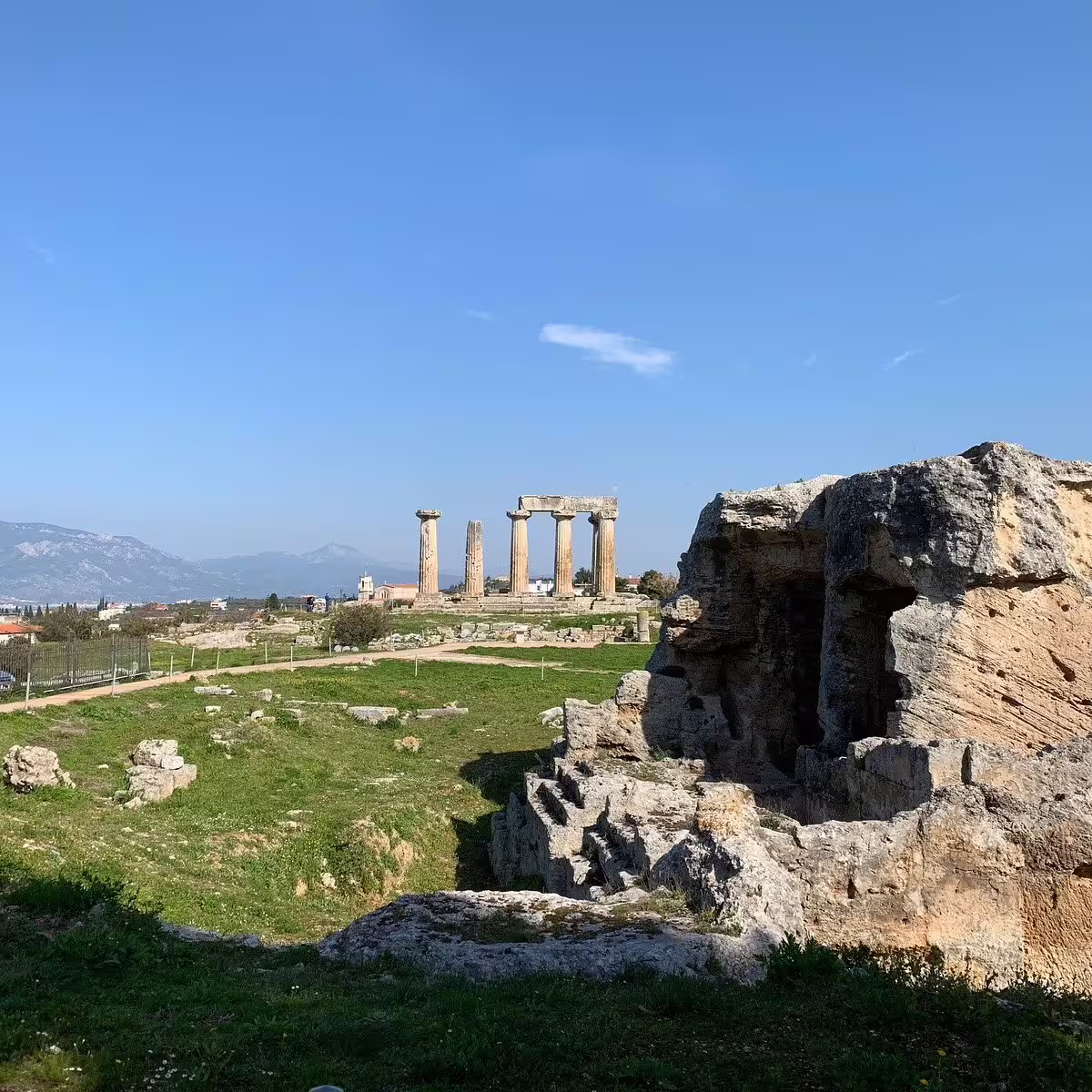 Temple of Apollo columns in Ancient Corinth ruins, scenic highlight on a private biblical tour from Athens