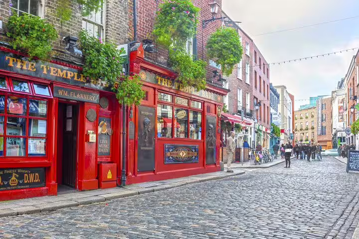 Temple Bar Dublin street with red pub fronts and cobblestones, ideal stop on a self-guided scavenger hunt