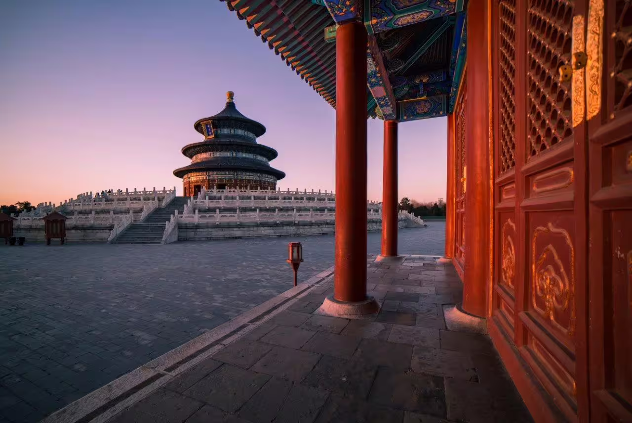 Sunset view of Temple of Heaven showcasing traditional architecture on China Explorer private tour in Beijing.