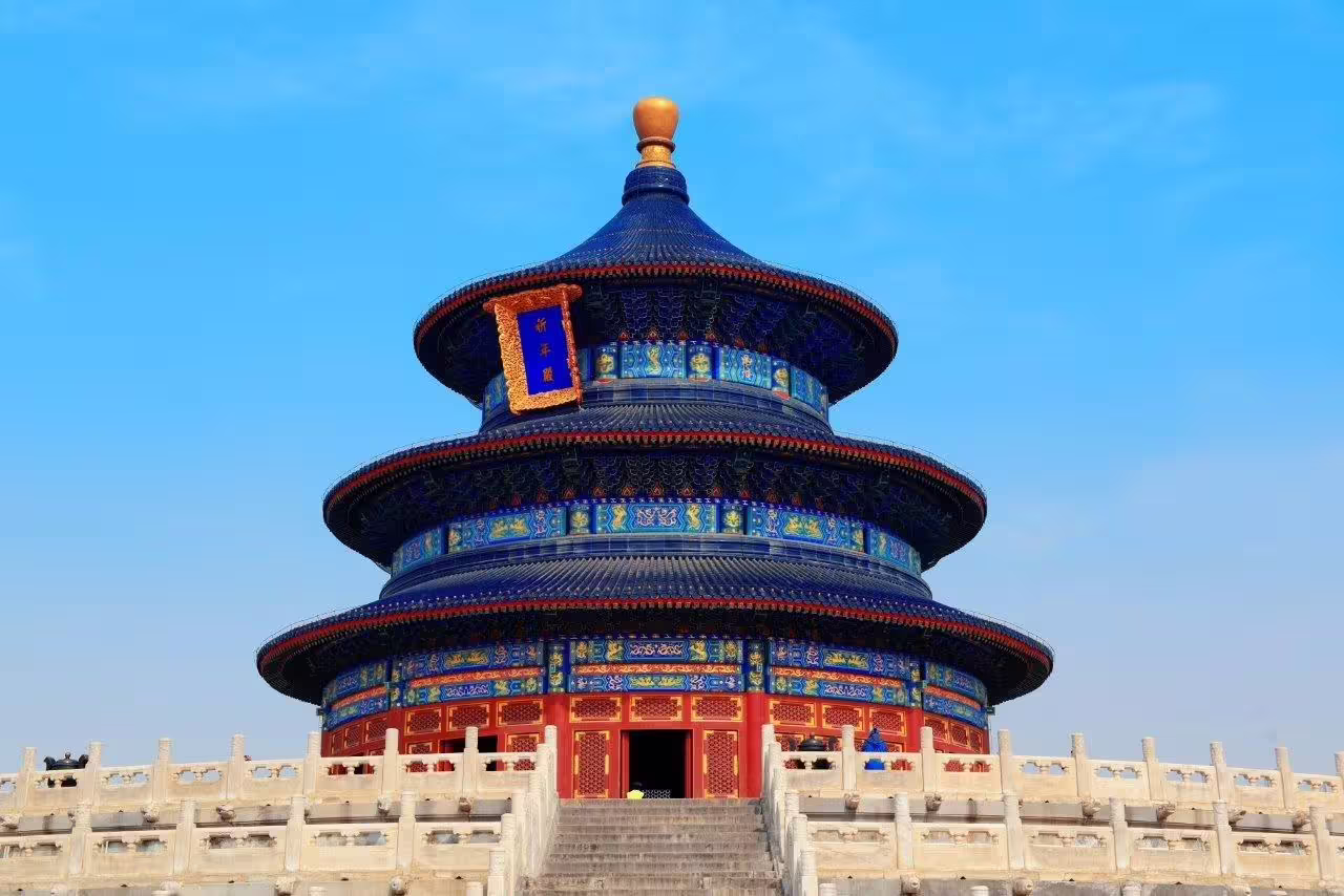 Majestic Temple of Heaven with ornate blue roof under clear sky, iconic site on China's private tour.
