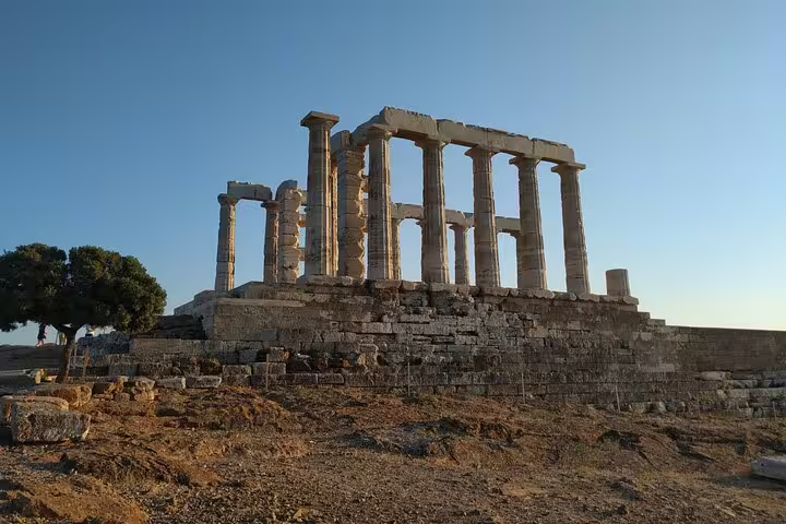 Temple of Poseidon at Cape Sounio in golden light, highlight of a private tour from Athens along the coast