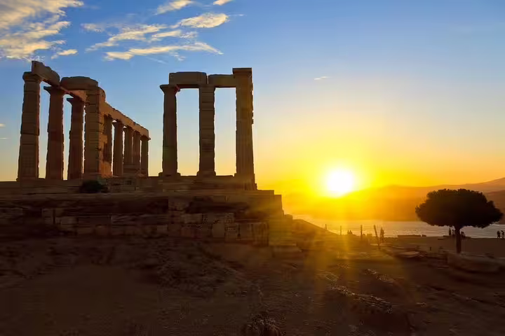 Sunset view of the Temple of Poseidon at Cape Sounio on a private full-day Athens tour along the Athenian Riviera