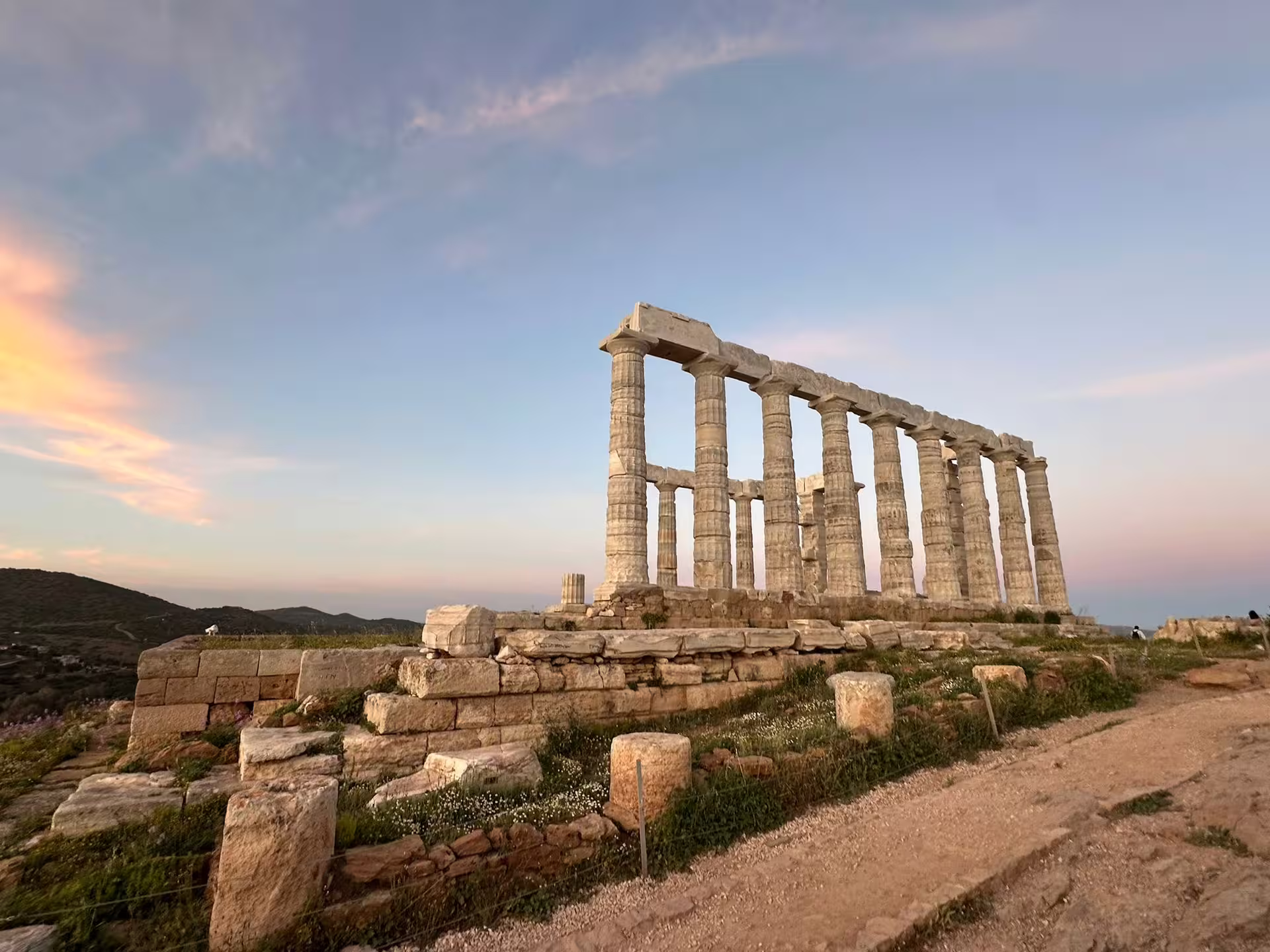 Temple of Poseidon at Cape Sounio at sunset, highlight stop on private Athens panorama and Sounio 8-hour tour