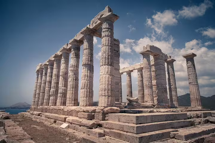 Wide view of Temple of Poseidon ruins at Cape Sounion, highlight of Athens private full-day tour with meal