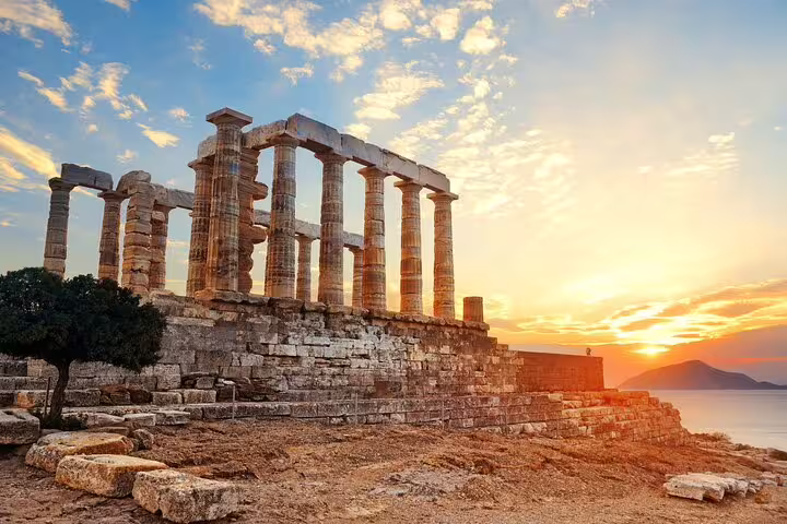 Sunset view of the ancient Temple of Poseidon at Cape Sounion, a highlight of full-day or half-day trips from Athens.