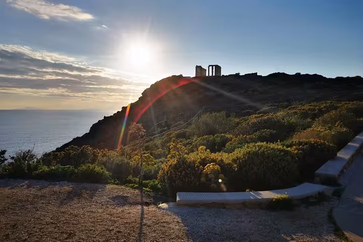Sunset view of Temple of Poseidon at Cape Sounion on a luxury private Athenian Riviera tour from Athens