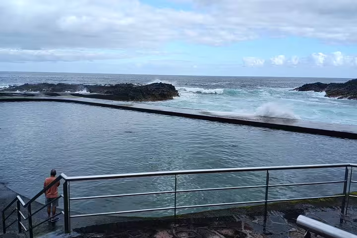 Natural ocean pool with waves crashing against the rocks at Tenerife's North Coast, ideal for private tours.