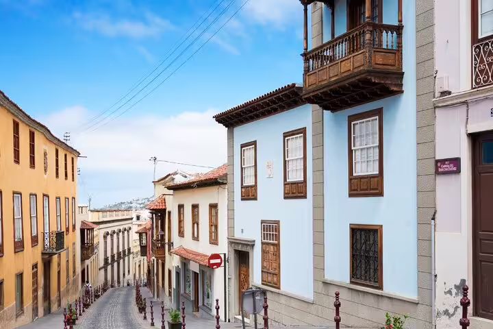 Charming street in Tenerife lined with colorful historic buildings, perfect for exploring on a private tour.