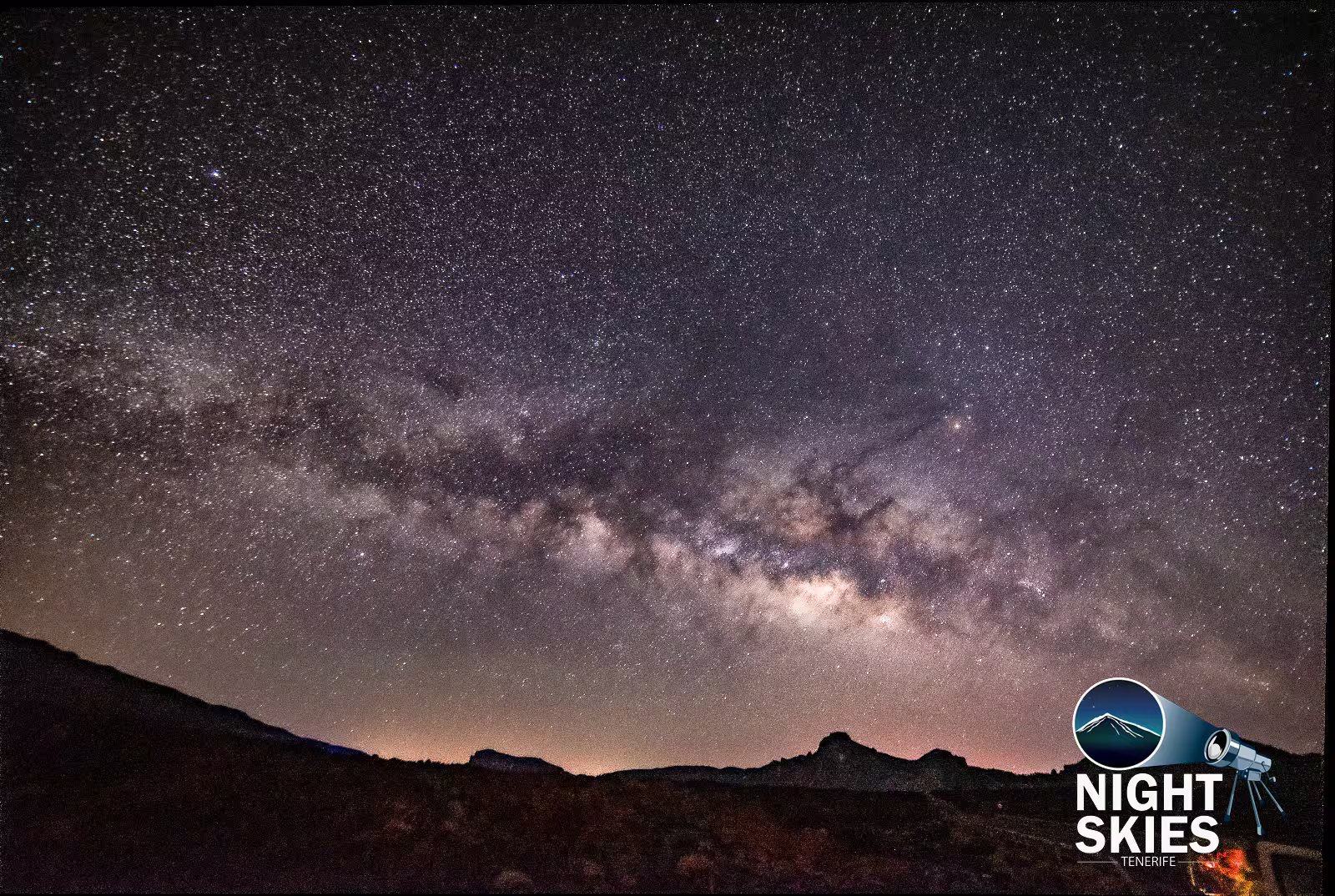 Starry night sky with Milky Way over Tenerife's landscape, perfect for stargazing enthusiasts on a self-drive tour.