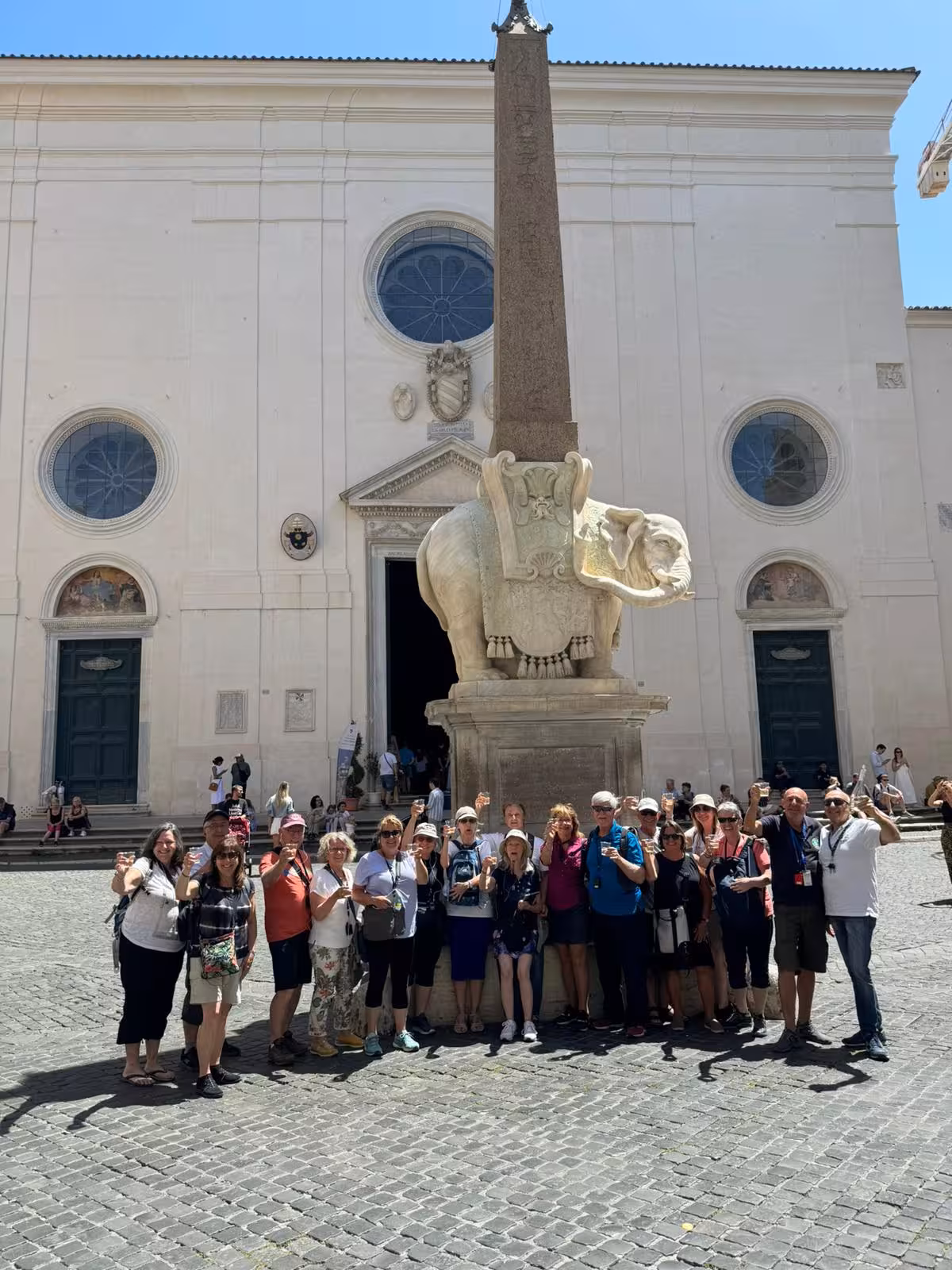 Tour group gathered around the iconic Elephant Obelisk in Rome, enjoying the cultural highlights of the TEST experience.