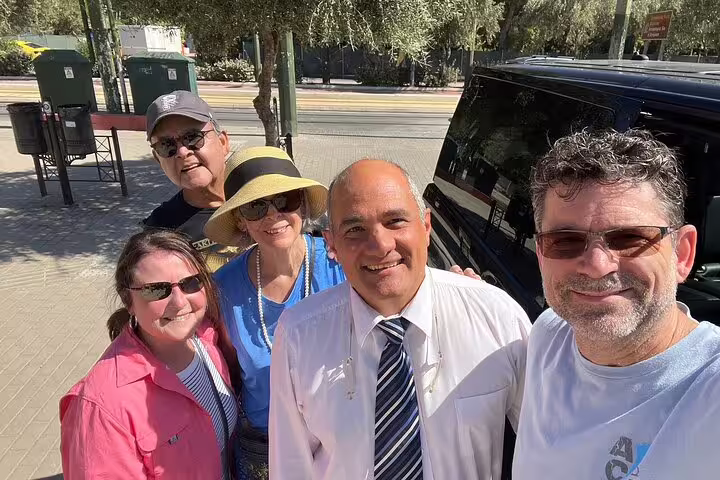 Happy guests with private driver by luxury van, starting Thermopylae Meteora Delphi full-day tour