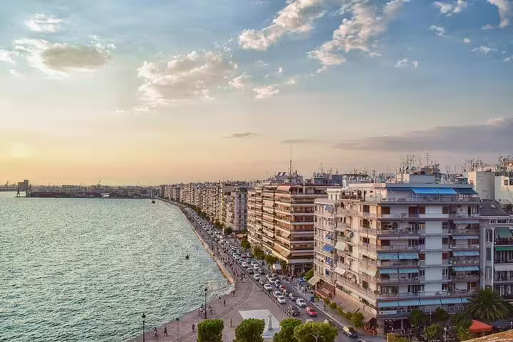 Thessaloniki seafront promenade at sunset, scenic start for private transfer from Thessaloniki to Athens