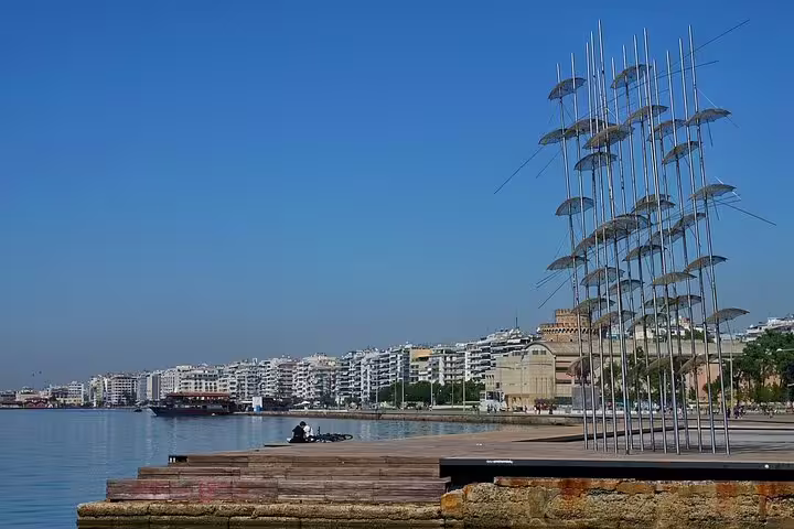 Thessaloniki waterfront with the iconic Umbrellas sculpture, perfect for a customized layover sightseeing tour.