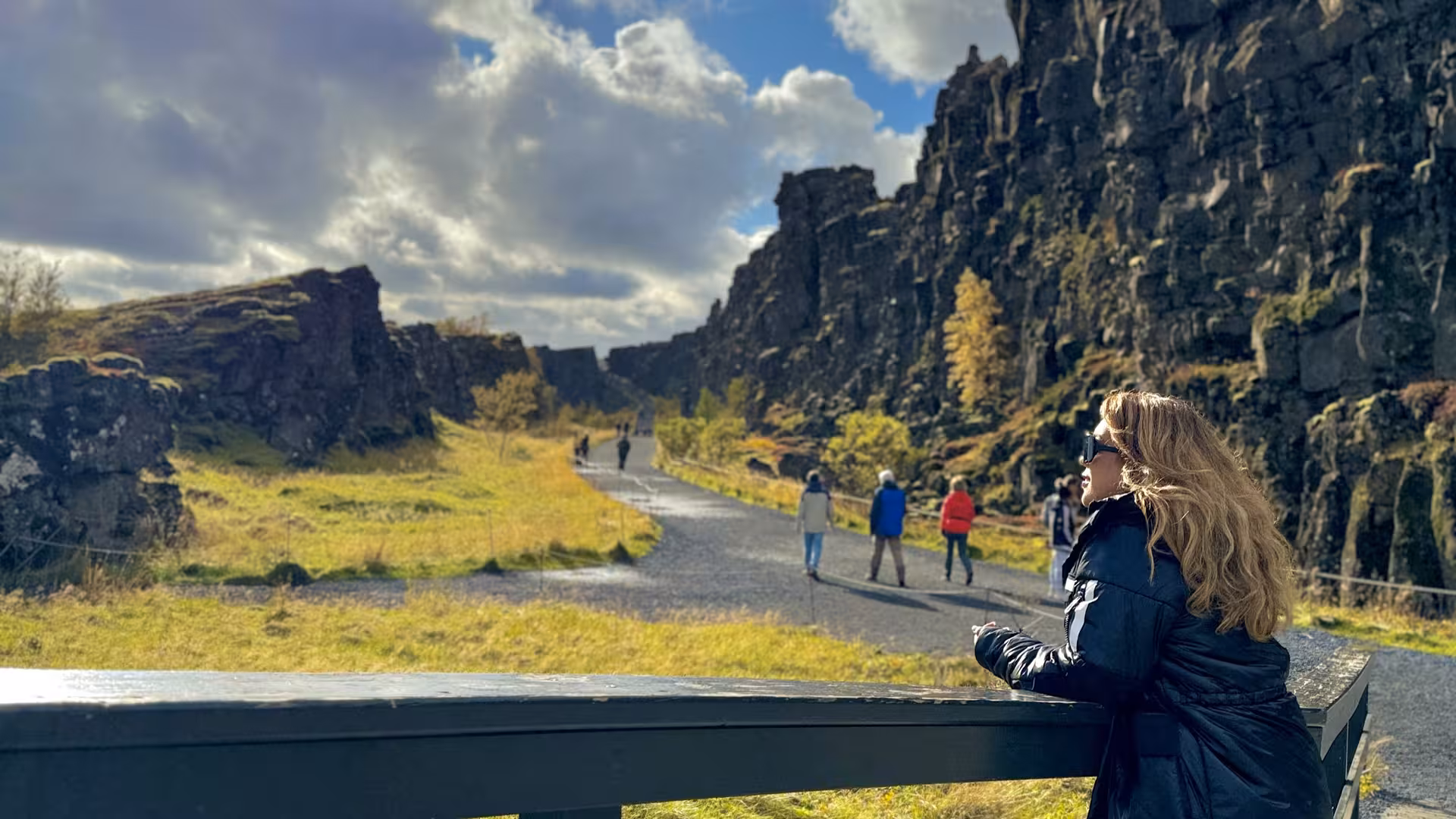 Visitors explore the scenic landscape of Thingvellir National Park, a key destination on the Golden Circle tour.