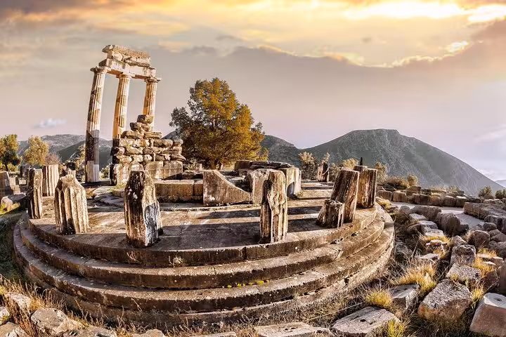 Tholos of Athena Pronaia in Delphi at sunset, Thermopylae and Delphi luxury private tour from Athens