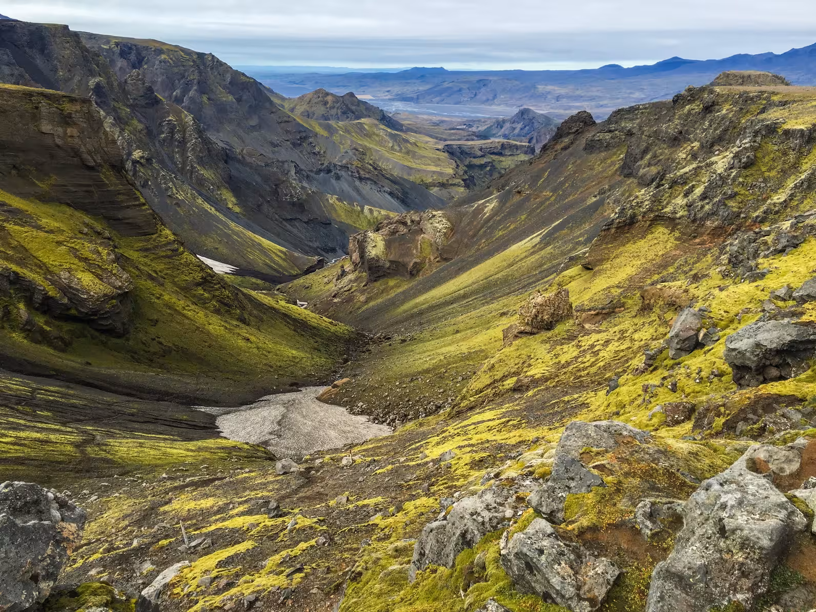Explore the lush, rugged landscapes of Thorsmörk Glacier Valley with its stunning green vistas and rocky terrain.