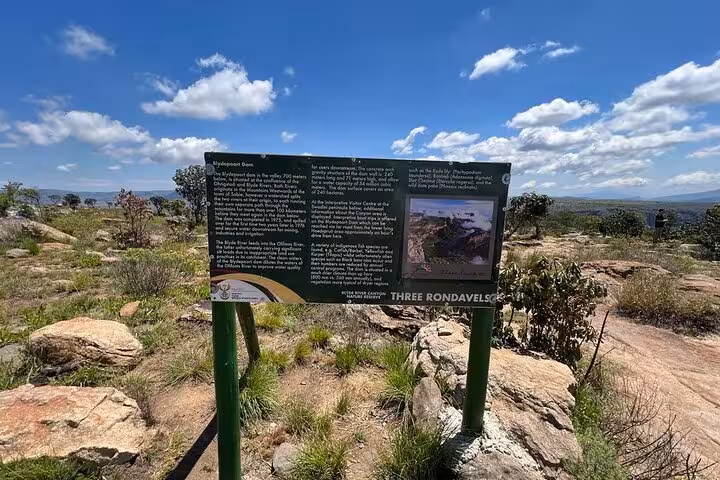 Informative sign at Three Rondavels viewpoint, highlighting attractions on the Panorama Guided Experience tour.