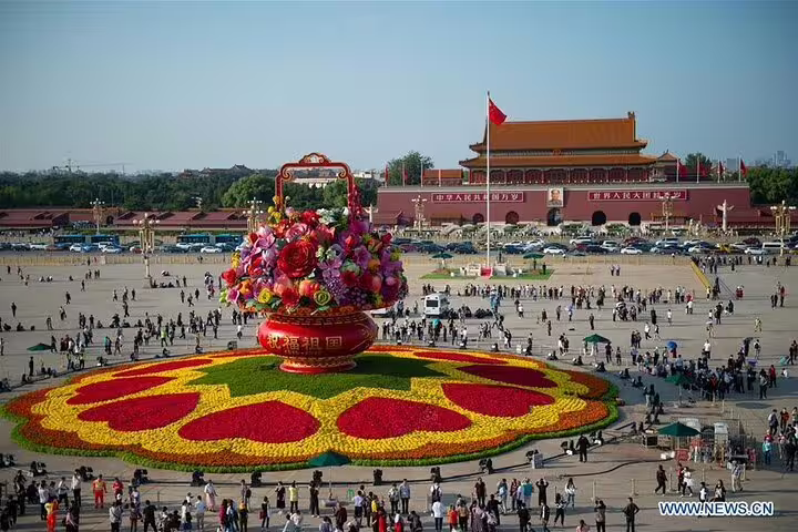 Discover Tiananmen Square's vibrant floral display, a cultural experience on the 14-day China and Yangtze River cruise tour.