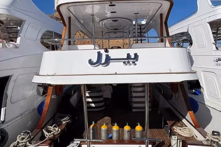 Tiran Island snorkeling tour boat in Sharm El Sheikh marina, ready for Red Sea trip with transfers and lunch