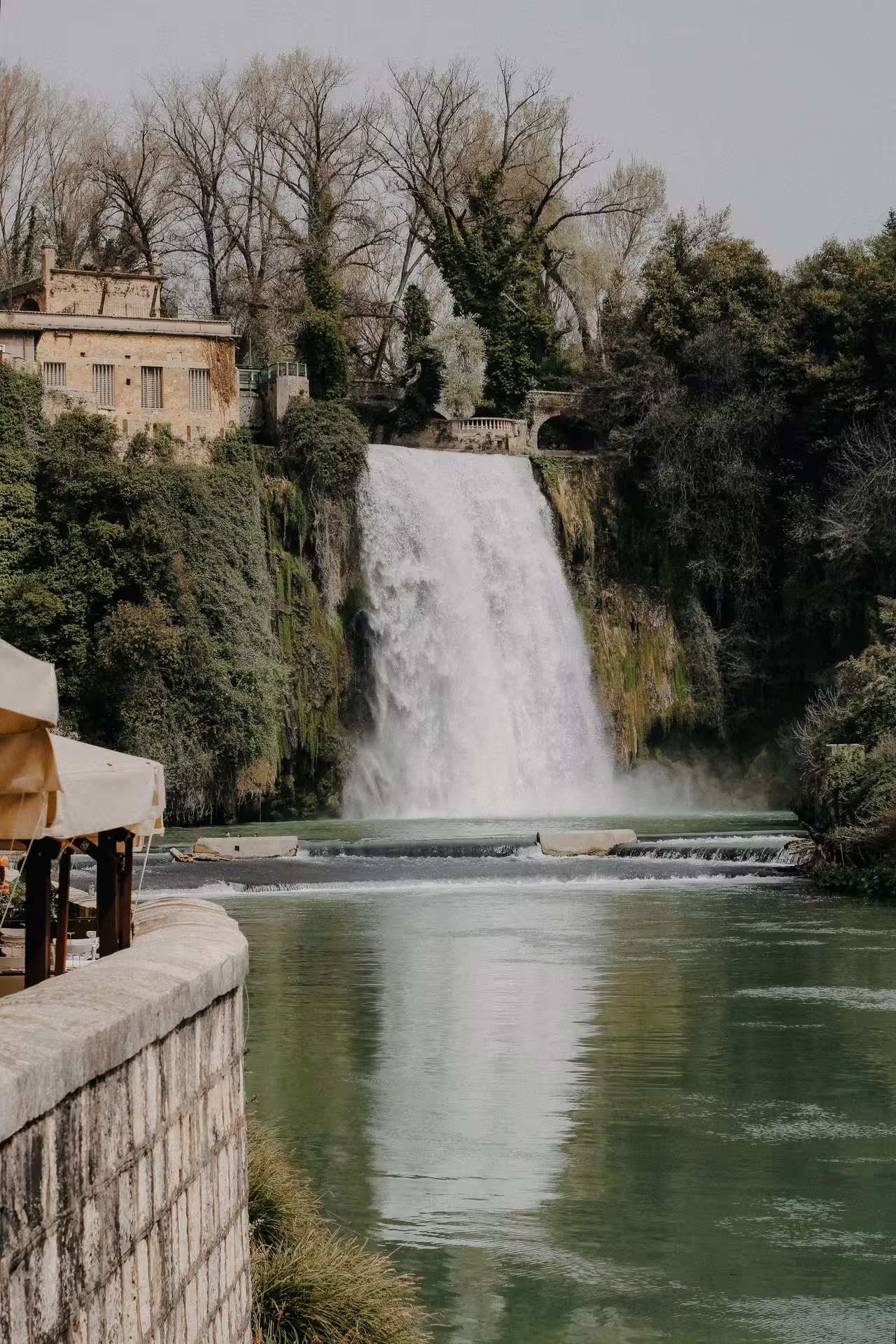 Witness the majestic waterfall in Tivoli's Villa Gregoriana on the charming Fiat '500 vintage tour.