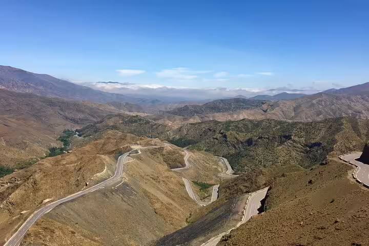 Winding Tizi n'Tichka Pass road in the Atlas Mountains on a 1-day private tour Marrakech to Ait Benhaddou