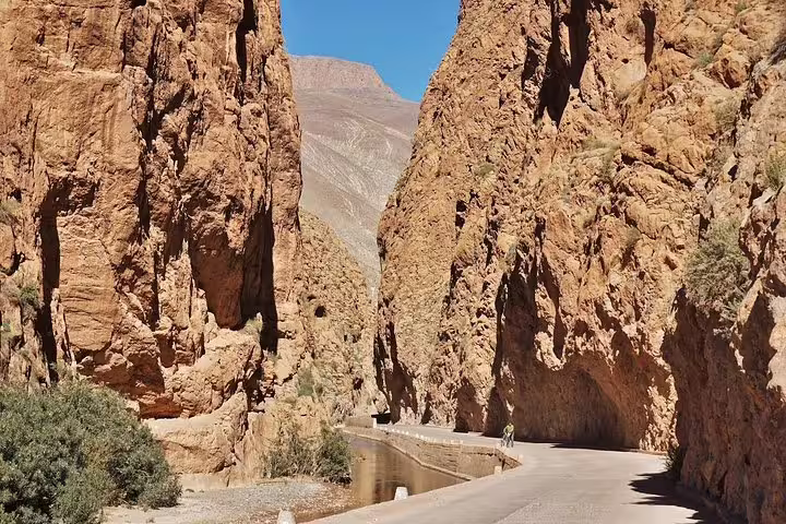 Road through Todra Gorge canyon cliffs near Tinghir, adventure stop on Morocco best 8 days tour from Tangier