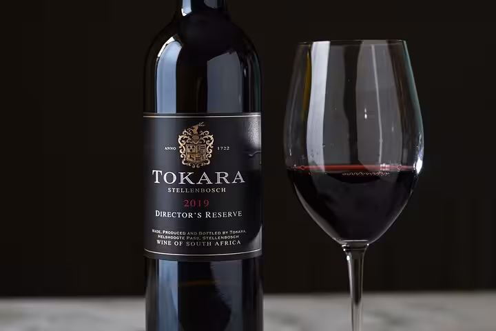 Tokara Stellenbosch 2019 Director's Reserve wine with glass, ideal for exclusive tastings on a Stellenbosch wine tour.