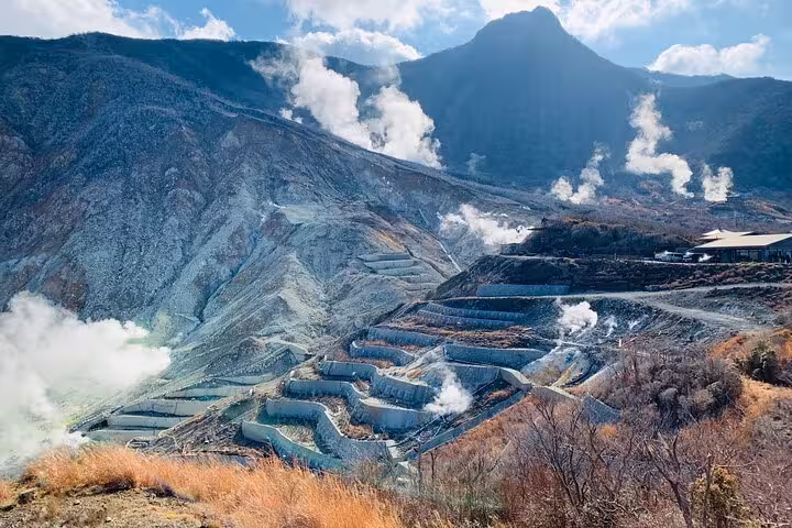 Panoramic view of Owakudani's steaming volcanic landscape, a highlight of the Tokyo to Hakone tour.