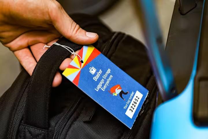 Close-up of luggage tag on backpack for Tokyo luggage storage near Akihabara Station, secure same-day drop-off