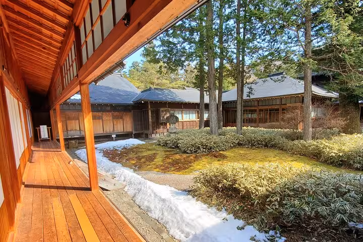 Serene courtyard with wooden walkway on Tokyo to Nikko English guided private tour.