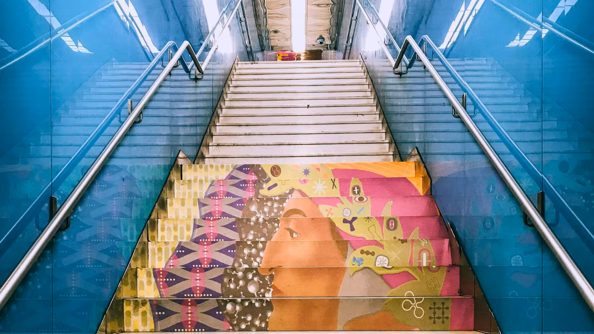 Artistic staircase mural at Toledo Metro Station, Naples, featured on the guided Line 1 artists' tube tour.