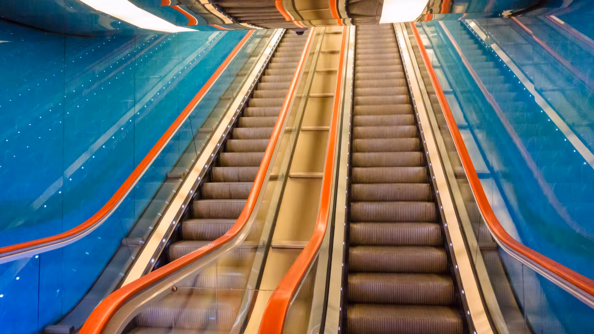 Vibrant escalators in Toledo Metro Station, Naples, showcasing modern design on the guided Line 1 art tour.
