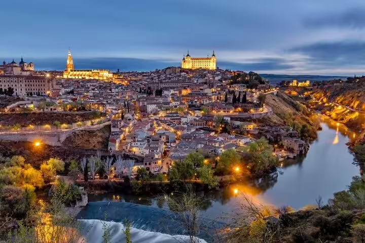 Twilight panorama of Toledo and Tagus River, highlight viewpoint on a private minivan tour from Madrid