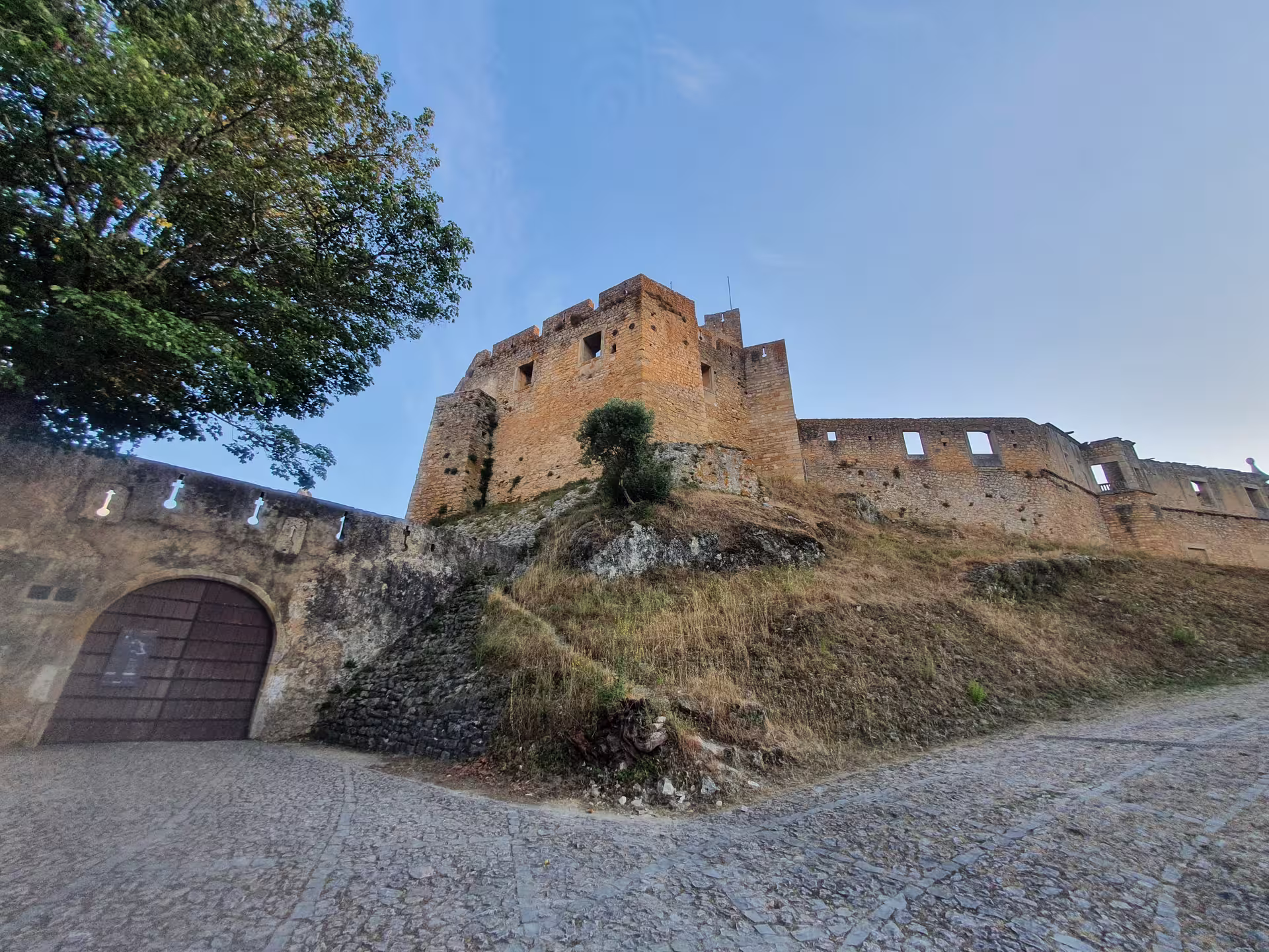 Medieval castle in Tomar, Portugal, showcasing historic Knights Templar architecture on a private full-day tour from Lisbon.
