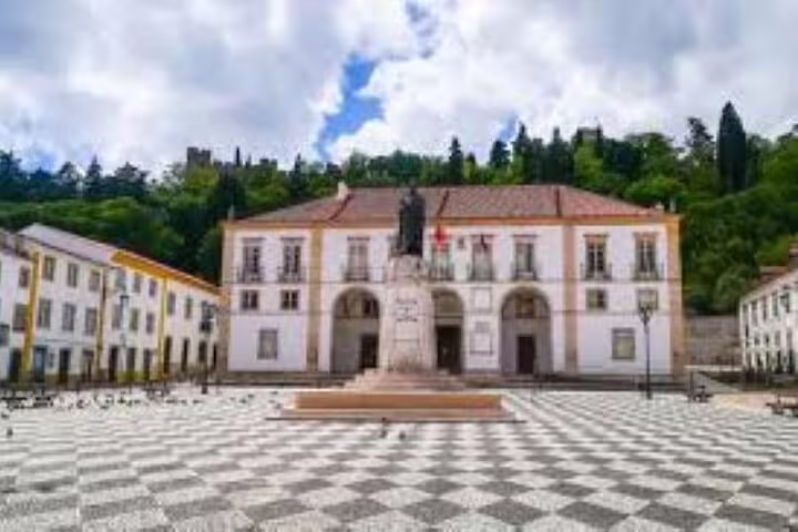 Visit Tomar's historic town square with its impressive statue and charming architecture on the Templars Route tour.