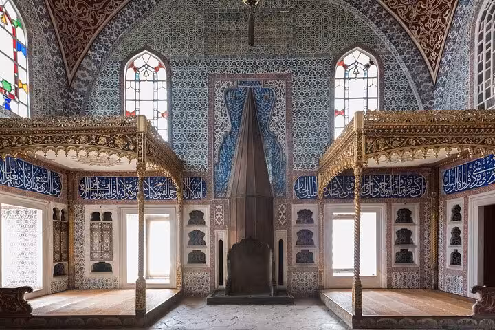 Topkapi Palace Harem chamber with blue Iznik tiles and gilded canopy, Istanbul half-day history tour