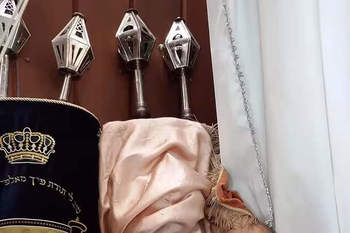 Torah scrolls and silver finials inside Manaus synagogue, cultural stop on Jewish tour in the Amazon