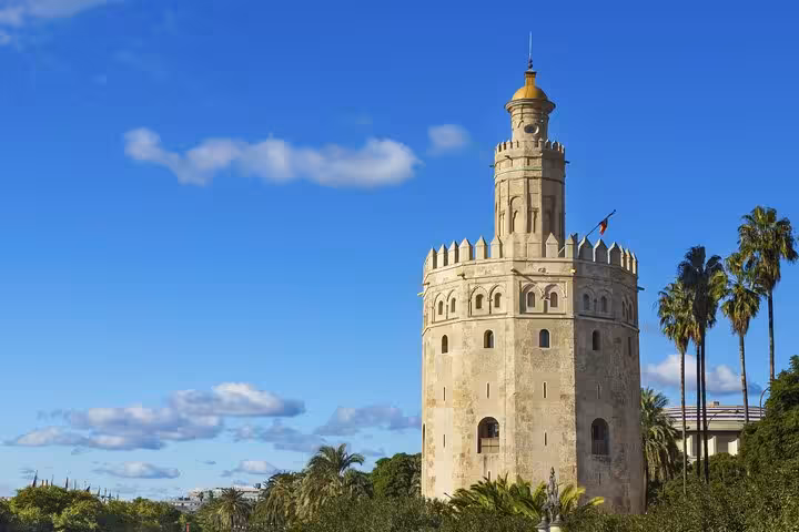 Iconic Torre del Oro in Seville, a must-see on the 5-day guided tour from Lisbon through Andalucia and Madrid.