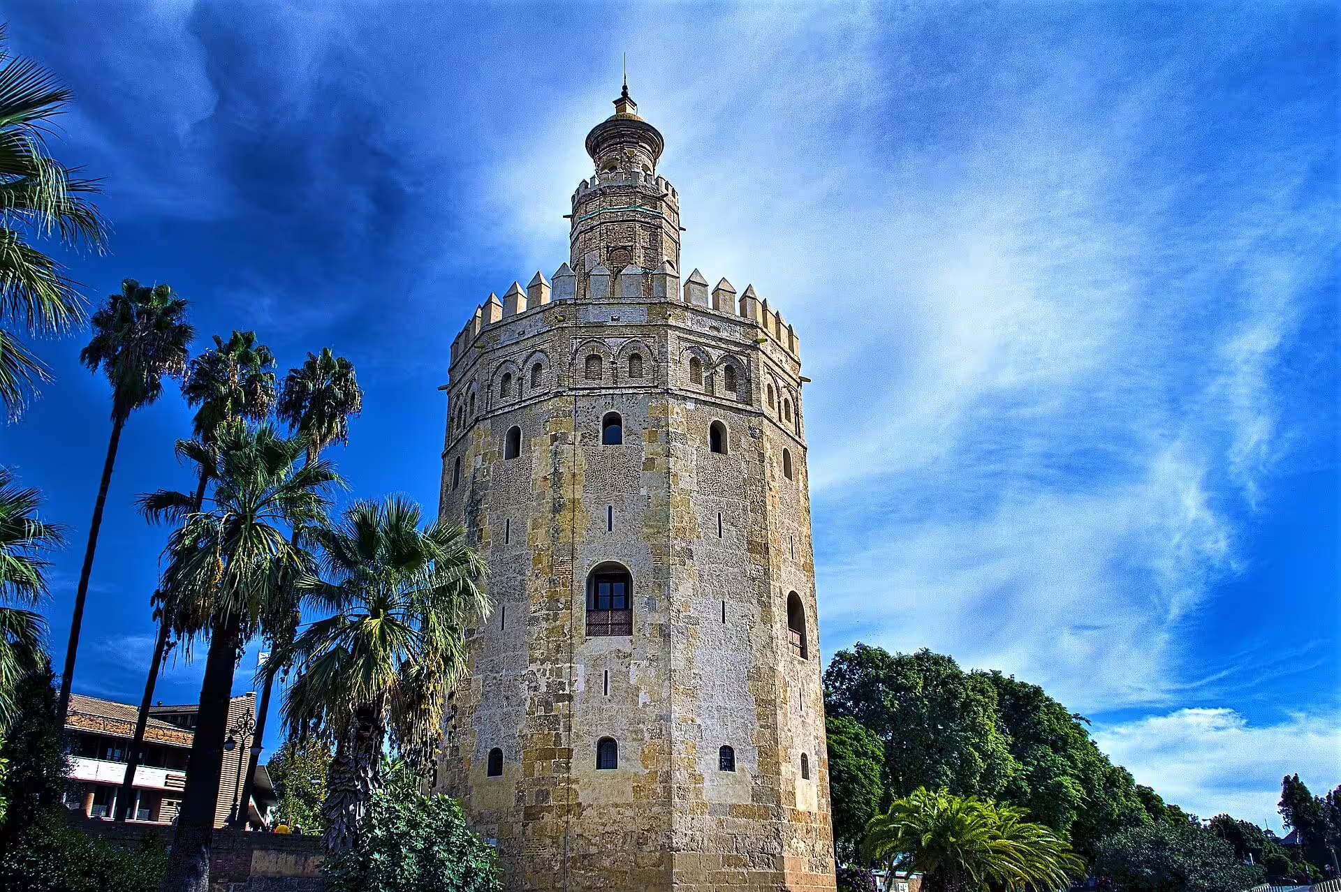 Torre del Oro in Seville by the Guadalquivir River, a highlight stop on a guided group walking tour