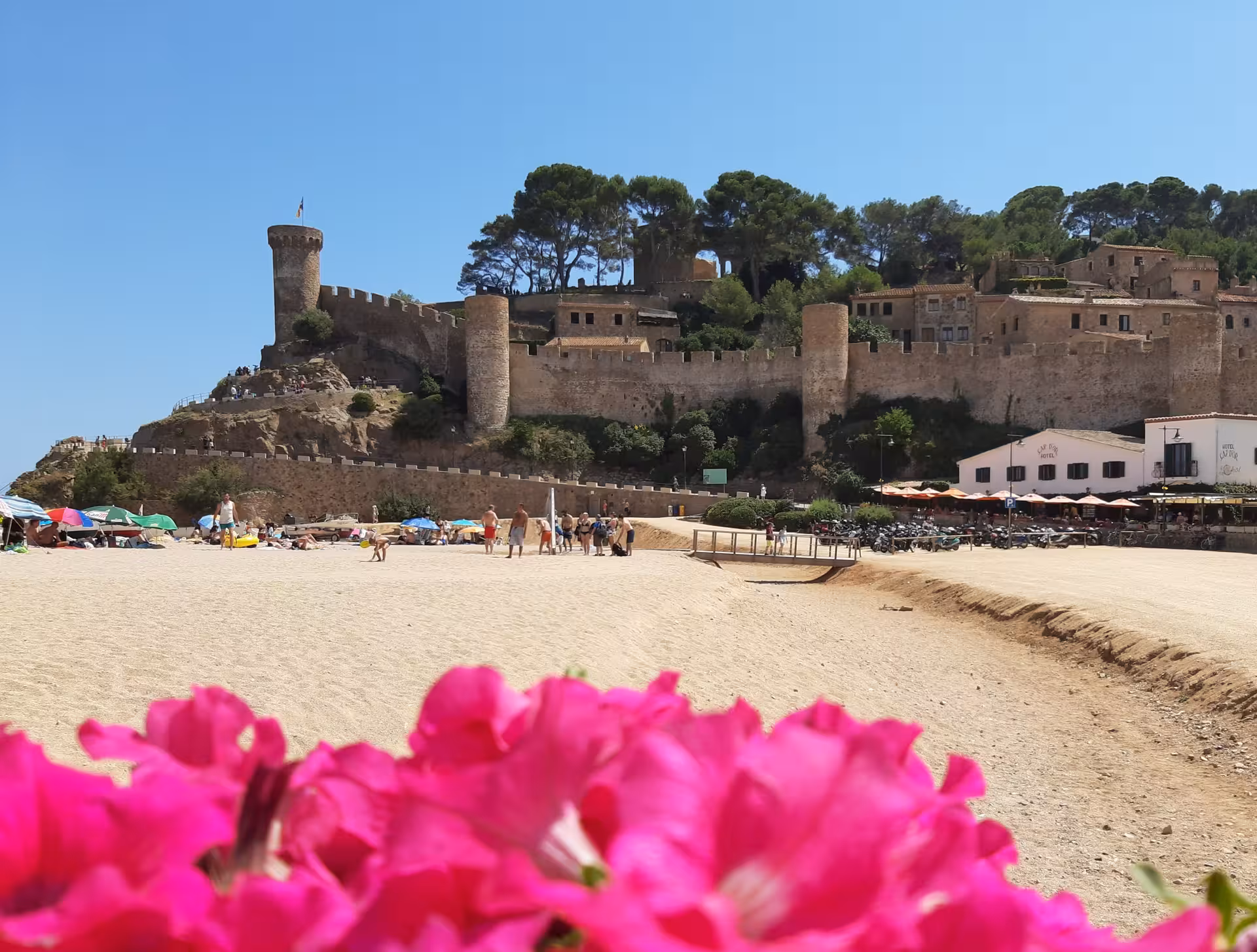 Sandy beach below Tossa de Mar medieval castle on the Costa Brava beach trip from Barcelona