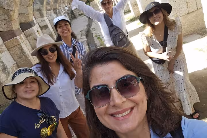Happy tour group selfie at ancient stone ruins on the 4 Days 7 Churches of Revelation Tour in Turkey