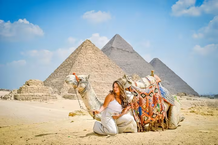 Tourist with decorated camel at the Giza Pyramids, Cairo day trip Pyramids Saqqara Memphis tour with lunch