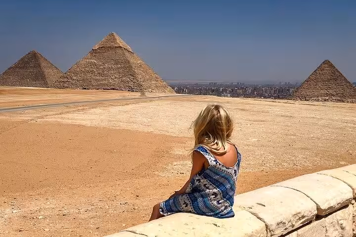Tourist overlooking the Pyramids of Giza near Cairo on a full-day bus excursion from Sharm El Sheikh