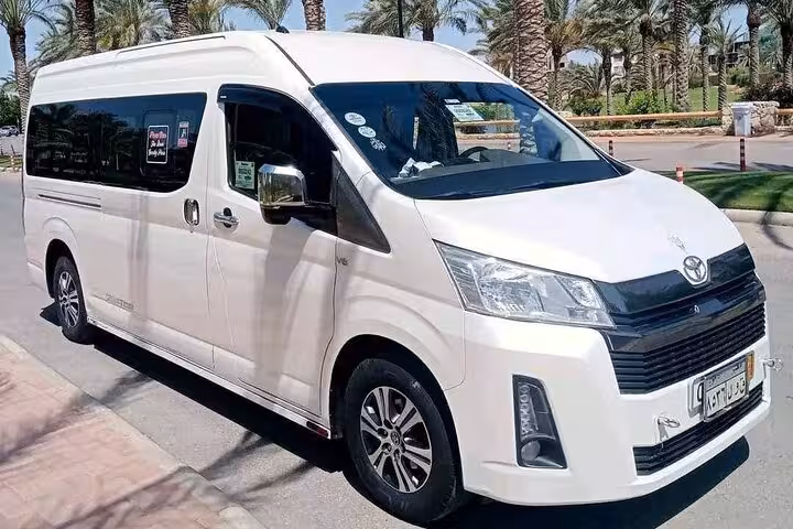 White Toyota Hiace van for private transfer in Sharm El Sheikh, hotel pickup to any destination, AC and luggage
