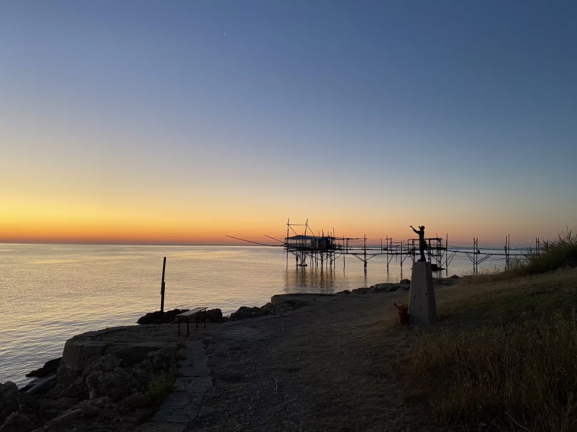 Sunset view of a traditional trabocco fishing platform on the Trabocchi Coast, Abruzzo coastal fishing tour