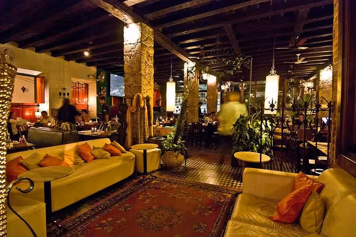 Warmly lit traditional Brazilian diner with plush seating, offering live music and signature caipirinhas.