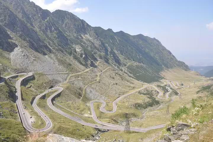 Aerial view of Transfagarasan Road winding through Fagaras Mountains in Romania