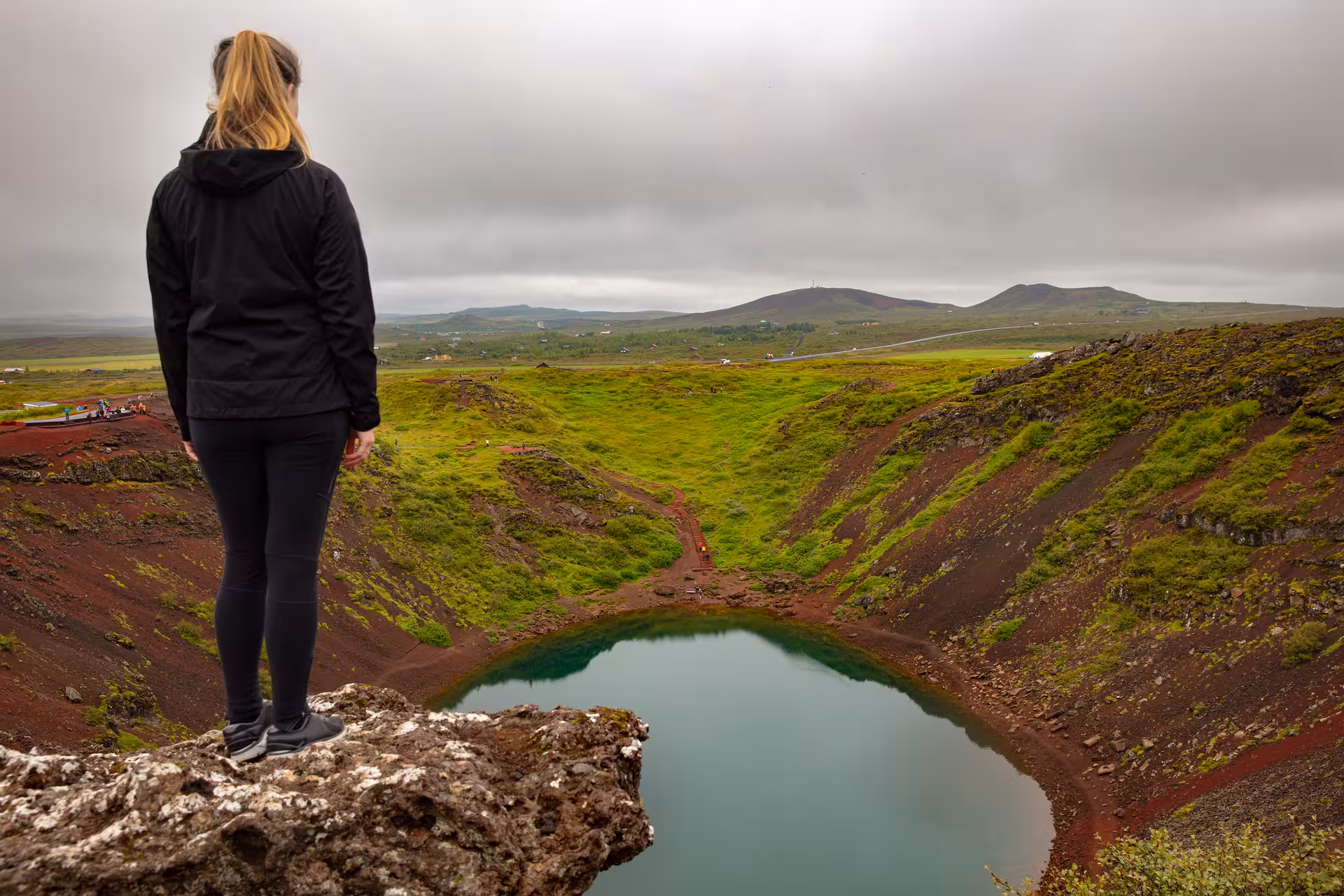 Traveler overlooking Kerid Crater Lake on Iceland Golden Circle Rally Car Experience sightseeing stop