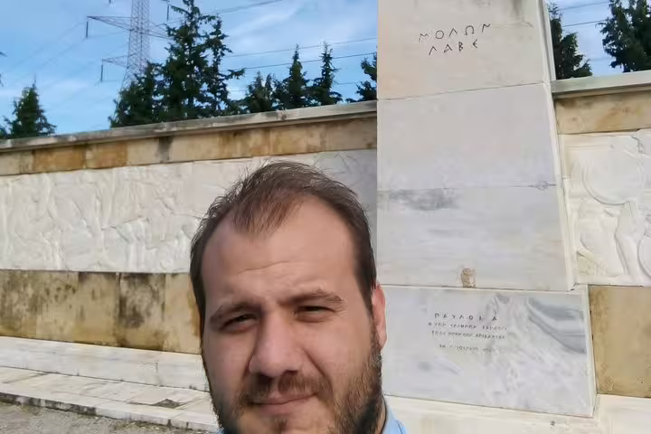 Traveler at Leonidas monument in Sparta, Greece on full-day Ancient Sparta, Kaiadas and Mystras tour