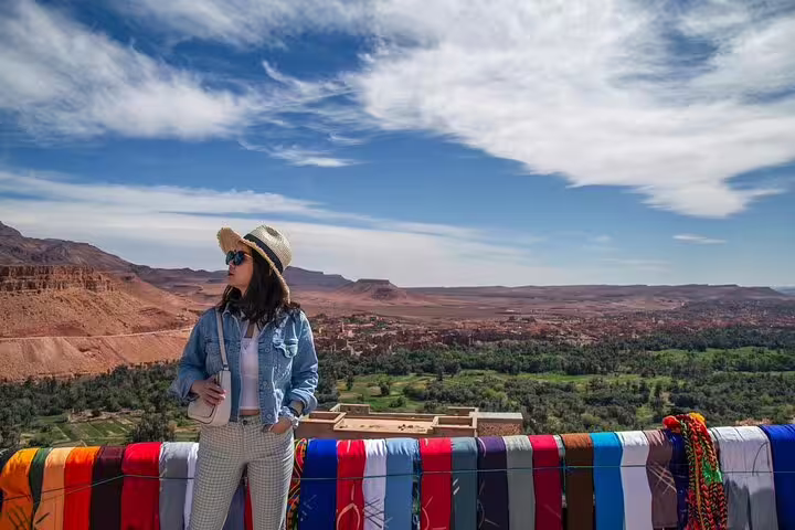 Traveler at panoramic Ouarzazate valley viewpoint on Morocco 11-day Casablanca to Sahara Desert tour